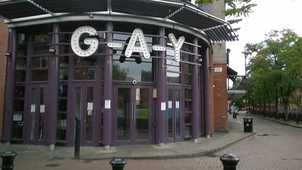 Rainbow flags and canalside bars along Canal Street in Manchester's Gay Village — 2