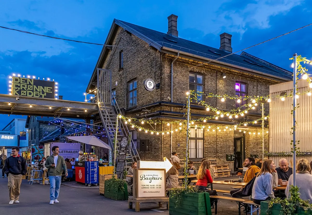Copenhagen nightlife street scene with bars in Nyhavn at night — 1