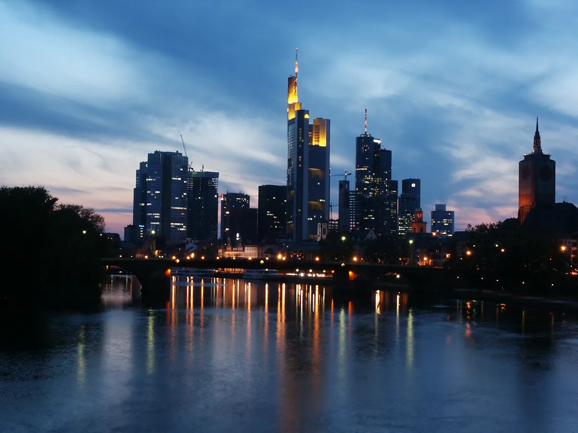 Frankfurt's Mainhattan skyline lit up at night above the Main river — 2
