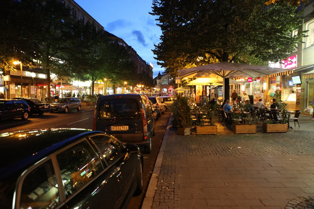 A well-lit street corner in Frankfurt's Bahnhofsviertel at night near the Hauptbahnhof — 2
