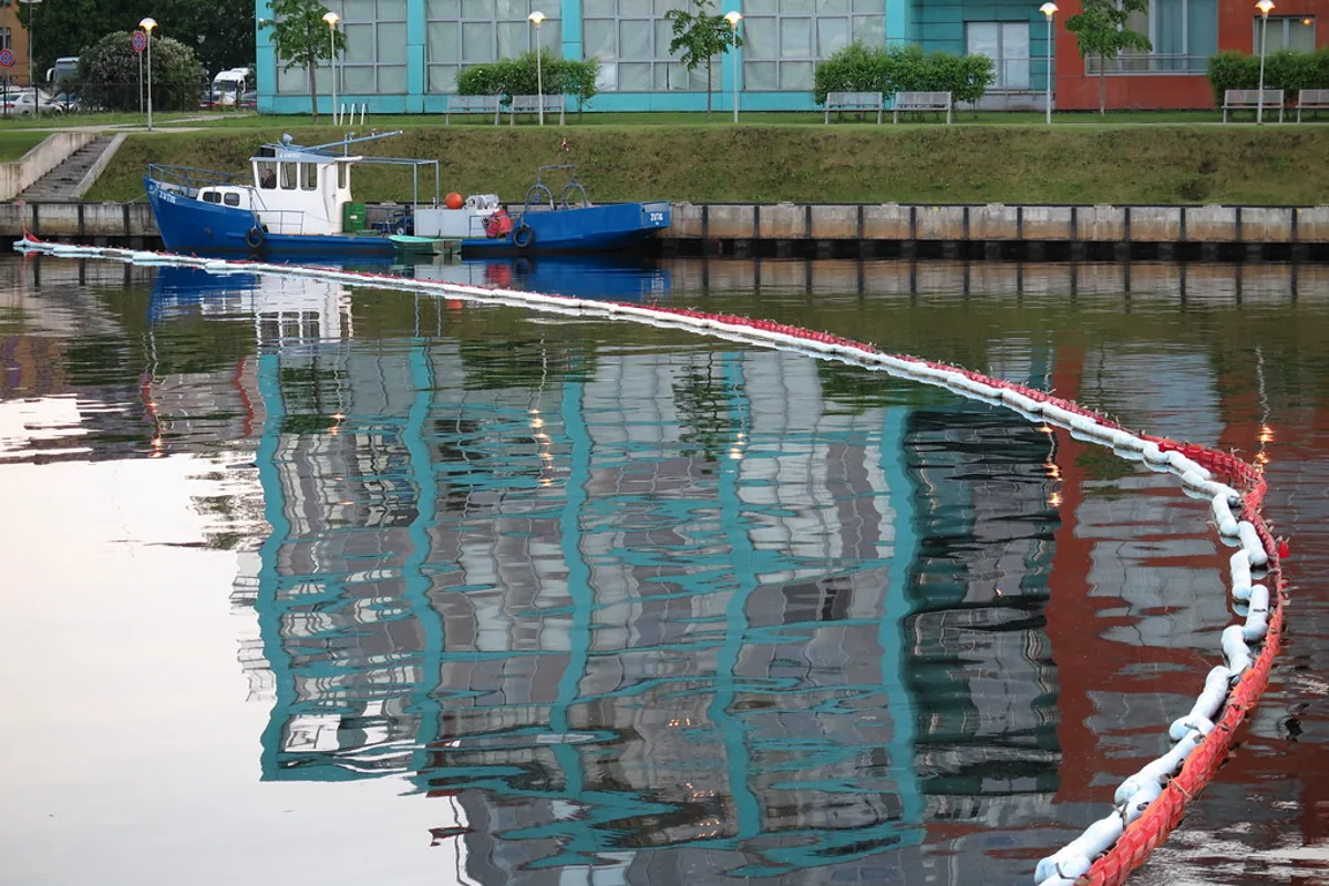 Daytime boat activity on the Daugava river in Riga