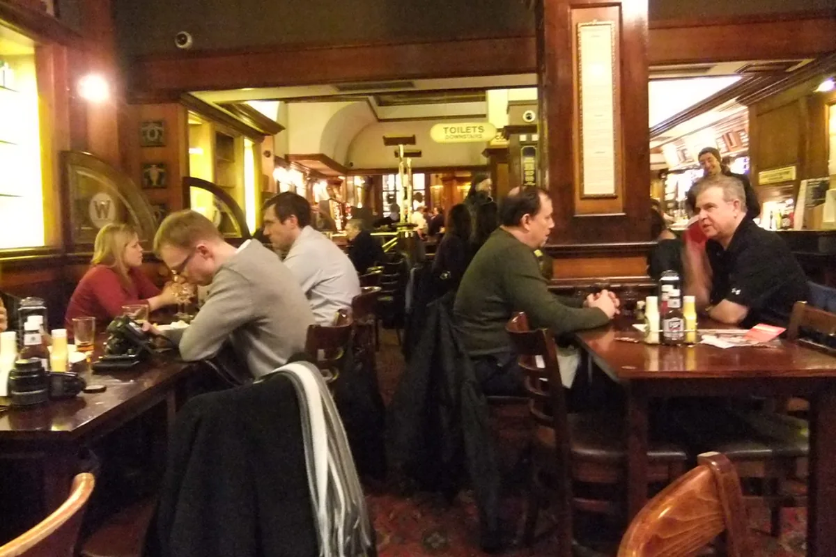 Group of friends toasting beers on a Riga stag weekend