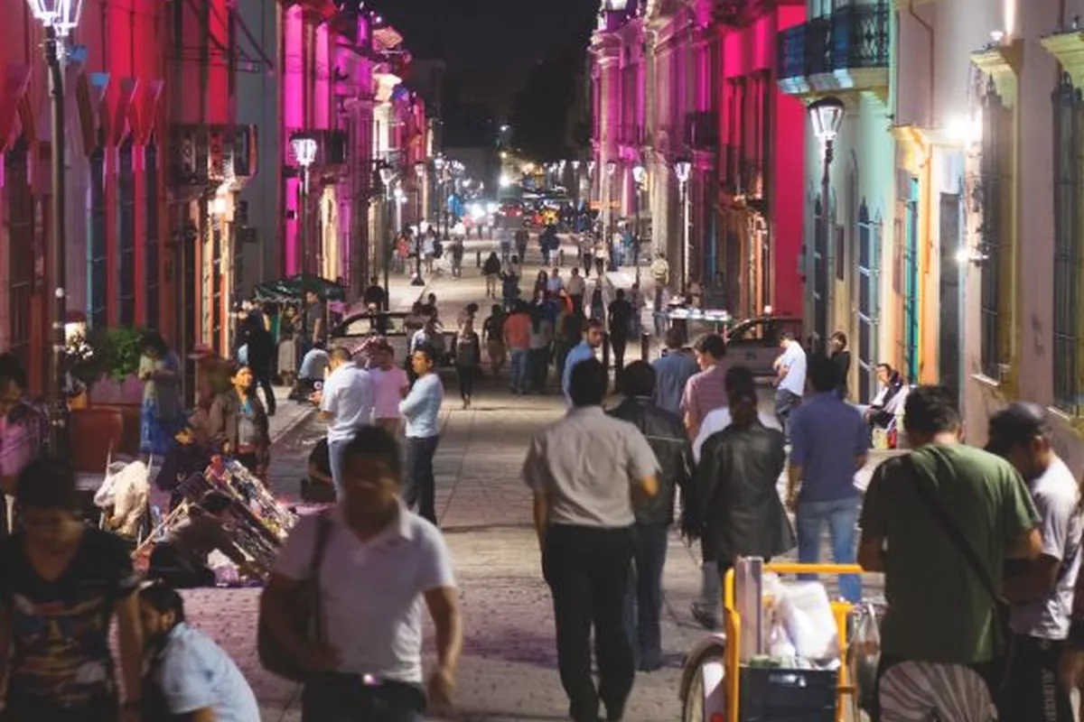 Lively nightlife crowd on a Sentrum street on a summer night in Oslo