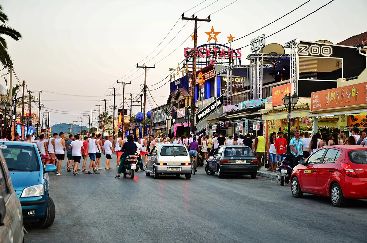 The neon-lit Laganas strip nightlife scene in Zakynthos, Greece — 2